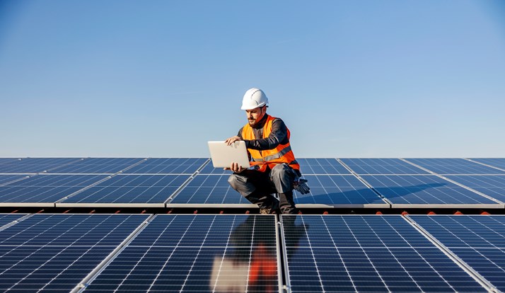 Engineer Looking At Solar Panels Plans